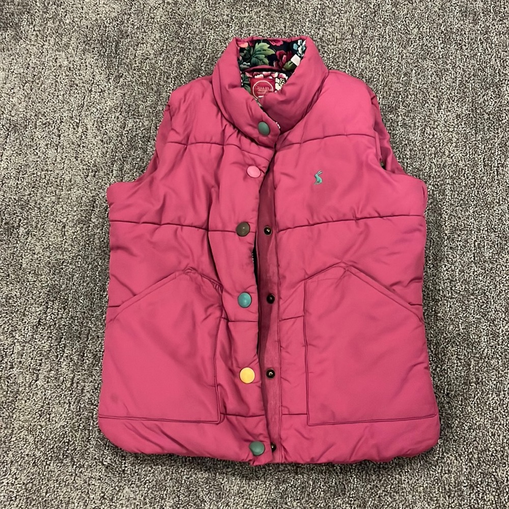 Pink vest, floral inside.